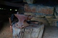 Blacksmith workshop with rusty old anvil and tools Royalty Free Stock Photo