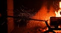 Blacksmithing Fire Sparks Forging Metal in Workshop with Bright Flames Royalty Free Stock Photo