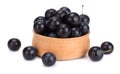 blackthorn berries in wooden bowl with green leaf isolated on white background Royalty Free Stock Photo