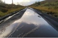 blacktop road, with water running down the surface in sheets