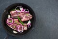 Blade chop and chopped chillies and onions in frying pan Royalty Free Stock Photo