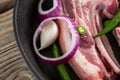 Blade chop and chopped chillies and onions in frying pan Royalty Free Stock Photo