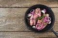 Blade chop and chopped chillies and onions in frying pan Royalty Free Stock Photo