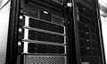 Blade server in rack cluster hard drives storage in internet data center room black and white tone Royalty Free Stock Photo