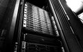 Blade server in rack cluster hard drives storage in internet data center room black and white tone Royalty Free Stock Photo