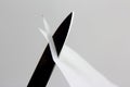 Blade of a sharp knife cut across the white paper Royalty Free Stock Photo