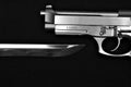 Blade under pistol Royalty Free Stock Photo