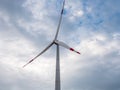 Blades on tower of Eletric power generator wind turbine at sunset against cloudy sky. Close-up. Adyghe wind farm Royalty Free Stock Photo