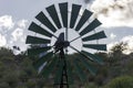 Blades of wind engine lifting water from well for watering wild animals