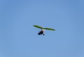 Flying hang-glider with a motor in the sky. Trike, flying in the sky with two people. Extreme Entertainment travelers