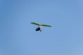 Flying hang-glider with a motor in the sky. Trike, flying in the sky with two people. Extreme Entertainment travelers