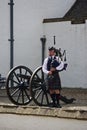 Blair Athol, Scotland: A bagpiper in traditional Scottish garb Royalty Free Stock Photo
