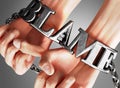 Blame, it brings misery and limits - a concept showing a person`s hands in chains with a word Blame as a symbol of its burden and