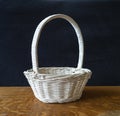 Blanching basket braided from twig on wooden table