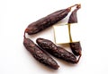 Blanck space tag in black chorizo spicy sausages for sale still life mediterranean white background