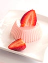 Blancmange with strawberries Royalty Free Stock Photo