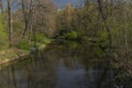 Blanice river with color green trees near weir in Bavorov town