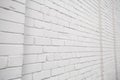 Blank ad space on a white brick wall in the street outside Royalty Free Stock Photo