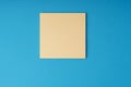 Blank adhesive note on blue background Royalty Free Stock Photo
