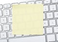 Blank adhesive note on keyboard Royalty Free Stock Photo