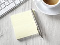 Blank adhesive note on desk Royalty Free Stock Photo