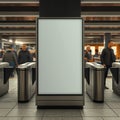A blank advertisement display between turnstiles in a subway station with people in the background Royalty Free Stock Photo
