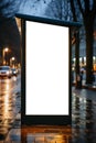 Blank advertising billboard on city street at night. Mock up Royalty Free Stock Photo