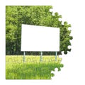 Blank advertising billboard immersed in a rural scene - concept image in jigsaw puzzle shape