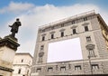 Blank advertising billboard on the scaffolding of the facade of an ancient building under restoration Royalty Free Stock Photo