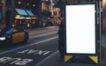 Blank advertising light box on bus stop, mockup of empty ad billboard on night bus station, template banner on background city Royalty Free Stock Photo
