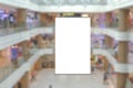 Blank advertising poster banner mockup in modern retail environment; vertical hanging billboard in shopping mall, out-of-home OOH Royalty Free Stock Photo