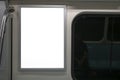 Blank advertising sign inside subway train.