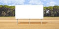 Blank advertising signboard in a flat land with trees on background - concept with copy space for text inserting