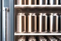 Blank Aluminum Beer or Soda Can With Droplets On Shelves In Refrigerator With Glass Door, 3d rendering. Minimalism Royalty Free Stock Photo