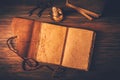 Blank antique leather-bound journal, book or diary with old books and candle Royalty Free Stock Photo