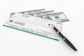 Blank Banking Check and Fountain Pen with Dollars Bills Royalty Free Stock Photo