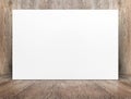 Blank banner white paper poster leaning at wood wall on wooden f Royalty Free Stock Photo