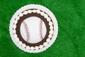 Blank baseball cake on a green fake grass