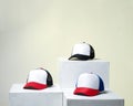 Blank baseball cap neatly displayed on a tiered stand. Royalty Free Stock Photo