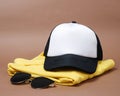 Blank baseball caps are used for design mockups. The hat on the side of an old camera and sunglasses. Royalty Free Stock Photo