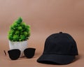Blank baseball caps are used for design mockups. The hat on the side of an old camera and sunglasses. Royalty Free Stock Photo