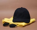 Blank baseball caps are used for design mockups. The hat on the side of an old camera and sunglasses. Royalty Free Stock Photo