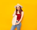 Blank beach or shopping eco bag in hands of smiling young girl in hat and yellow glasses standing over yellow background. Summer, Royalty Free Stock Photo