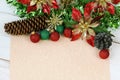 Blank beige paper to write wish lists with Christmas decoration Royalty Free Stock Photo