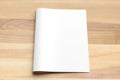 Blank Bi fold A4 size brochure mock up on wooden background. 3D Royalty Free Stock Photo