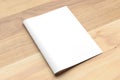 Blank Bi fold A4 size brochure mock up on wooden background. 3D Royalty Free Stock Photo