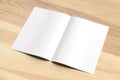 Blank Bi fold A4 size brochure mock up on wooden background. 3D Royalty Free Stock Photo