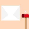 Blank Big White Envelope beside Red Mailbox with Small Flag Up. Open Color Postal Box in Loaf Shape Standing and Huge Royalty Free Stock Photo