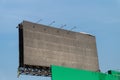 Blank billboard against blue sky for outdoor advertising poster in city Royalty Free Stock Photo