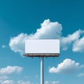A Blank Billboard Against a Bright Blue Sky with Soft White Clouds Creating a Perfect Canvas for Advertising Royalty Free Stock Photo